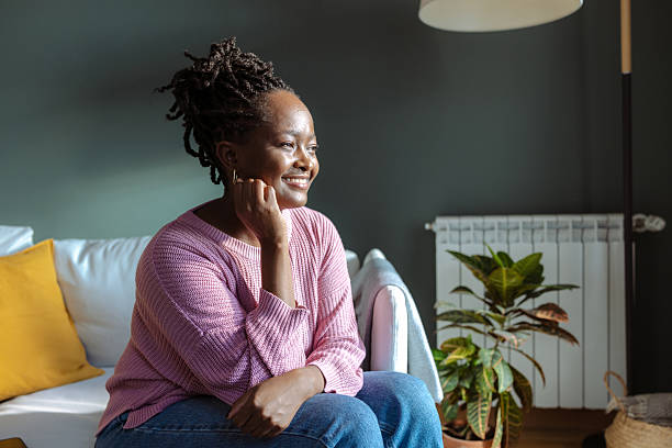 istock Thoughtful woman relaxing at home during a quiet afternoon 2224011024