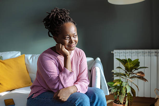 istock Thoughtful woman relaxing at home during a quiet afternoon 2224011433