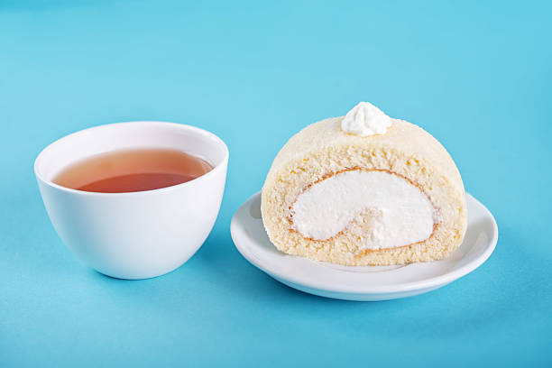 istock Vanilla cake roll with whipped cream filling in a plate 2224011612