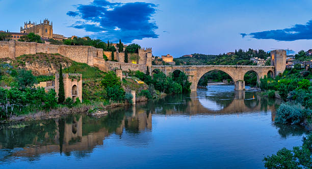 istock San martin bridge reflecting in tagus river at blue hour, toledo, spain 2224013122