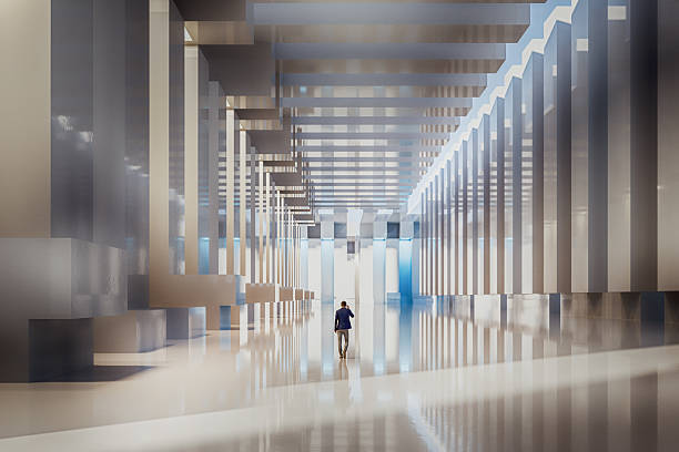 Businessman walking in futuristic corridor