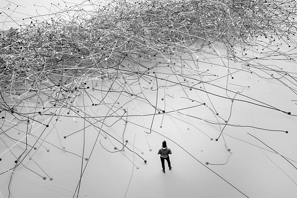 Man facing complex problems Man facing complex problems. 3D generated image. tangled wires stock pictures, royalty-free photos & images