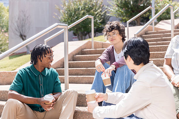 istock Diverse colleagues enjoy coffee together while connecting outside office 2224016185