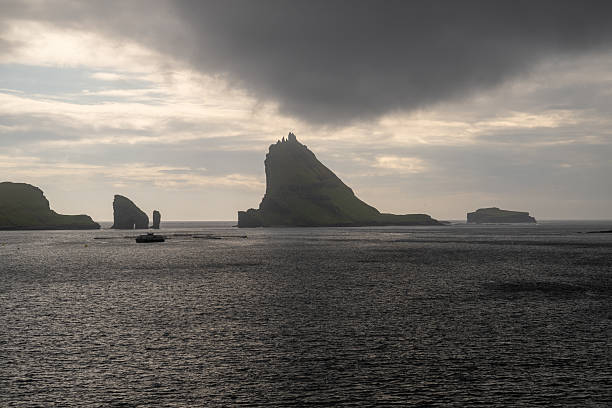 Faroe Islands Vagar, aerial drone view of Tindholmur island in North Atlantic Ocean. Faroe Islands, Denmark, Europe.