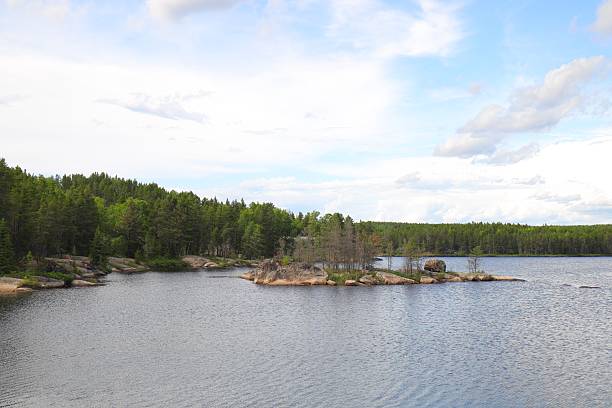 istock a lake with rocky islands and pine forest 2224022608