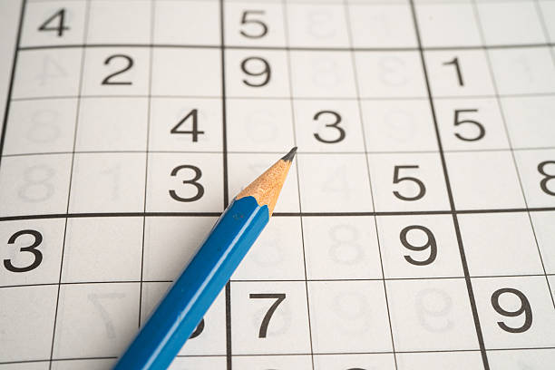 istock Sudoku puzzle game playing to challenge brain. 2224023271