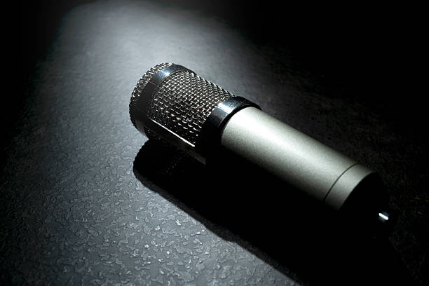 istock Studio microphone for podcasting or streaming with a black background 2224029823