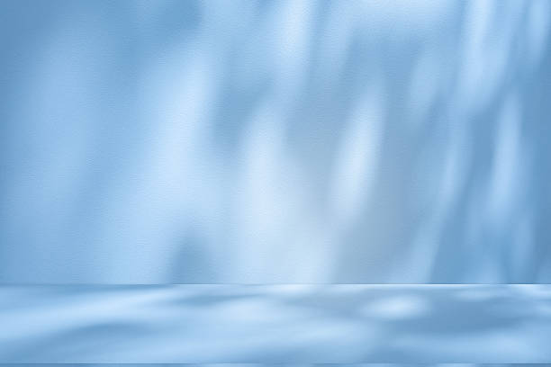 istock Studio style background wall decoration presentation uses white and blue tones. with shadows cast from a nearby window, concept creating a decorative 2224034649