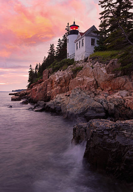 istock Bass Harbour Lighthouse at sunset with dramatic rocks and Atlantic Ocean on the foreground, Acadia National Park, Maine 2224034888