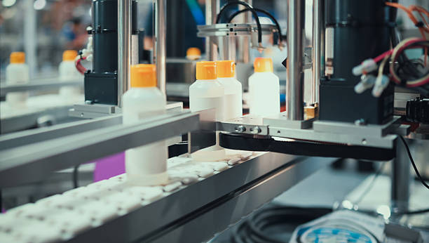 robotic filling and capping machine in sterile plastic bottle production line | automation in cosmetic, chemical, or medical product packaging