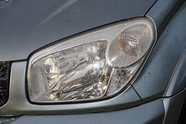istock shiny headlights on a gray silver  car 2224037247