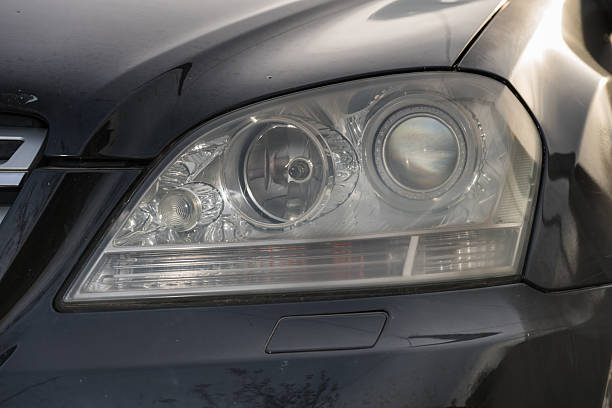 shiny headlights on a black   car