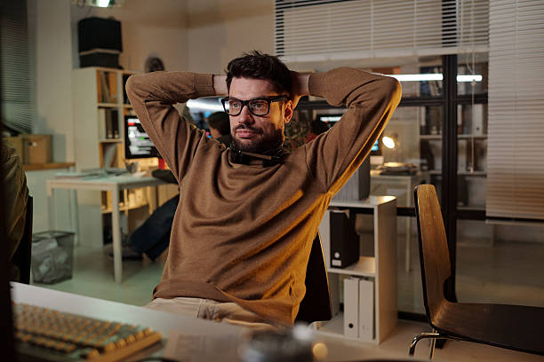 istock Caucasian Young Adult Man Leaning Back Reflecting on Scam Call Center Activity 2224037421