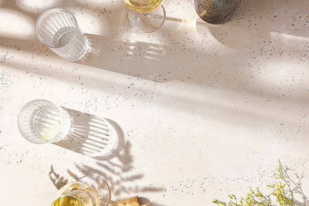 istock White wine glasses in bright overhead sunlight with minimalist flatlay composition 2224038410