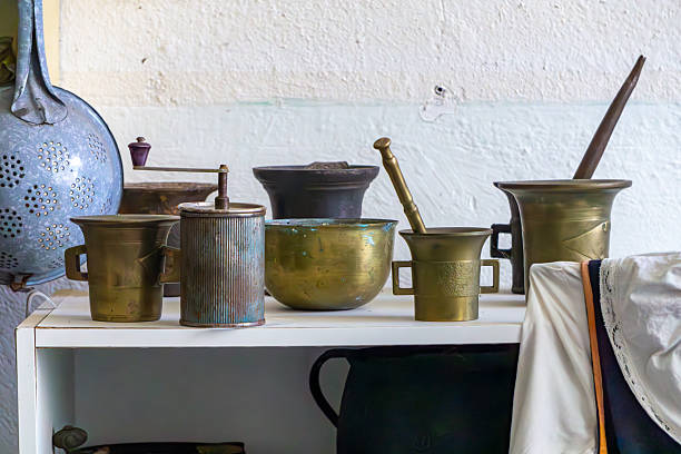 Copper stock pot with hanging copper sauce pots and prep table