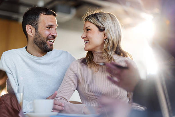 istock Happy couple talking while having a meeting with advisor. 2224043631
