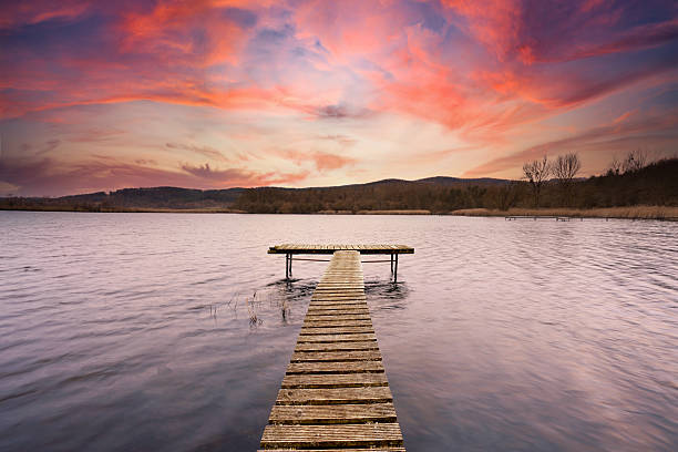 Whispers of the Sunset: Pier Over a Painted Sky