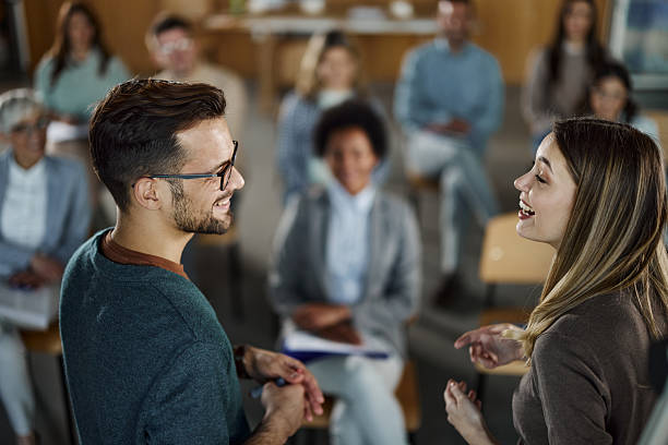 istock Happy business colleagues talking on a seminar. 2224043802