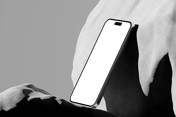 istock 3d render of Modern smartphone mockup with a blank screen on textured stones on a gray background. 2224045525