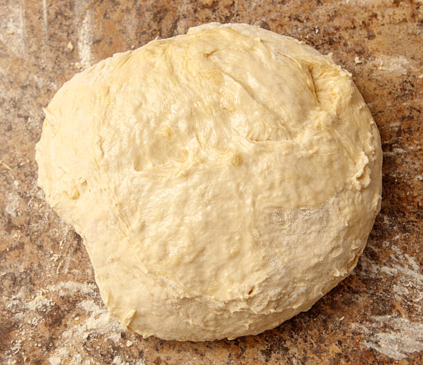 istock A piece of dough is sitting on a countertop 2224046257