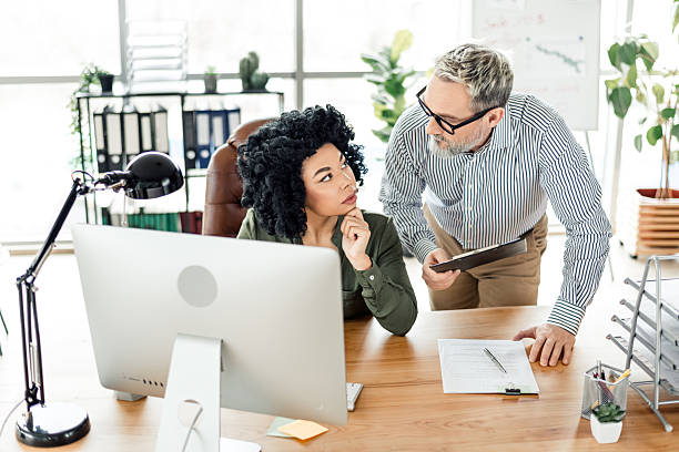 istock Business colleagues collaborating in a modern office environment 2224049622