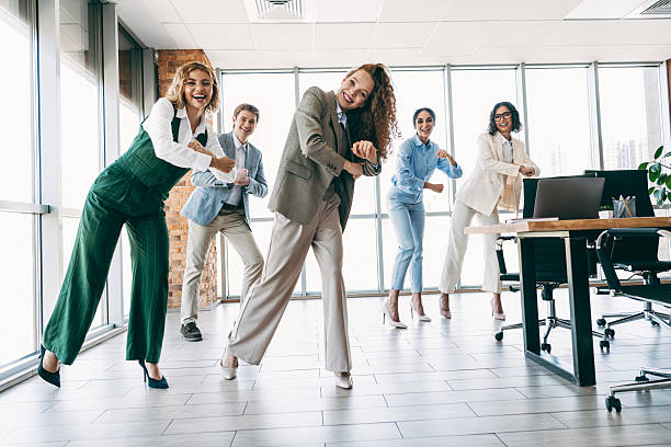 istock Professional team builds camaraderie through fun group activity in modern office environment emphasizing collaboration 2224053723