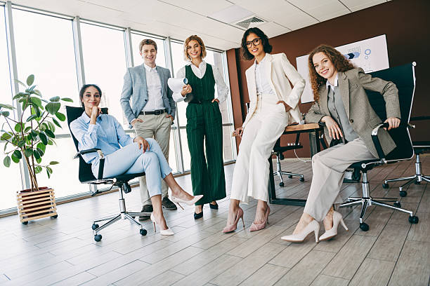 istock Group of diverse professionals collaborating in a modern office space, showcasing teamwork, business attire, and work environment 2224053796