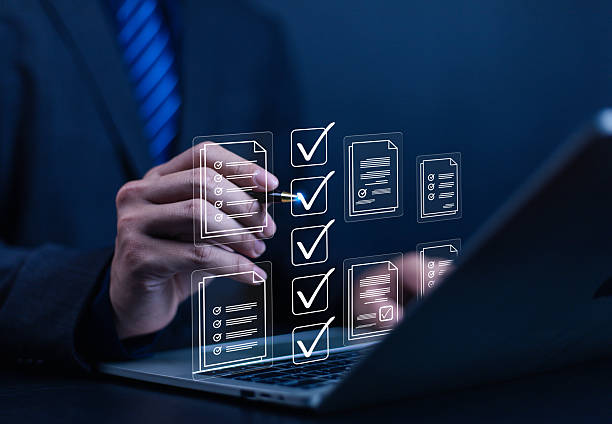 istock Businessman working on computer using laptop. Concept of business performance tracking and evaluation. Document management system DMS. Performance checklist evaluation form. 2224054322