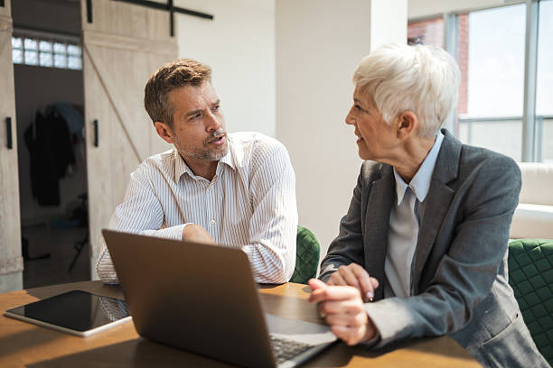 istock Business meeting discussion between colleagues in a modern office setting 2224056652