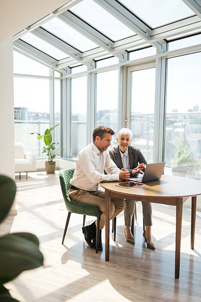 istock Colleagues collaborating in a bright office space during a business meeting 2224056666