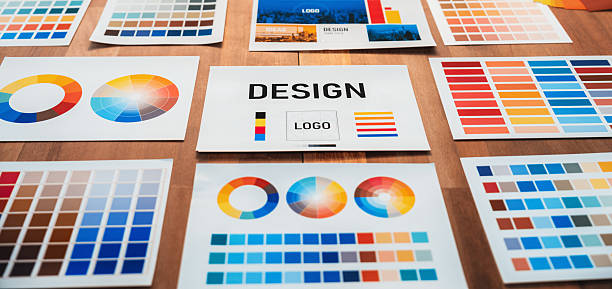 istock Various color palette idea papers arranged on workspace for designer. Scrutinize 2224057340