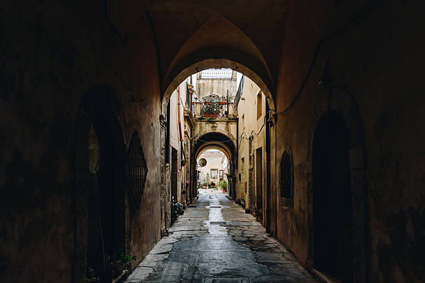 istock Old Arched Alleyway with Light and Shadows in Sicily 2224057412