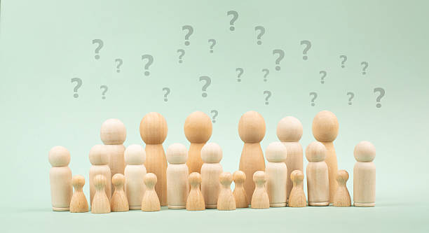 istock Crowd of people with question marks, searching for answers, brainstorming for solution, fear of future in society, education and business concept 2224058716
