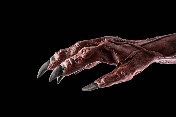 istock Red devil monster hand isolated on black background with clipping path 2224058850