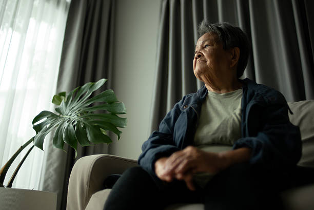 istock Senior woman contemplation on sofa. 2224059246