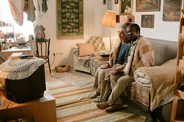 istock Diverse Senior Couple Sitting Together Watching Television 2224059619