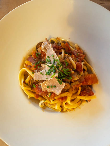 istock Delicious tagliatelle pasta with tuna, tomato sauce, and chives 2224059669