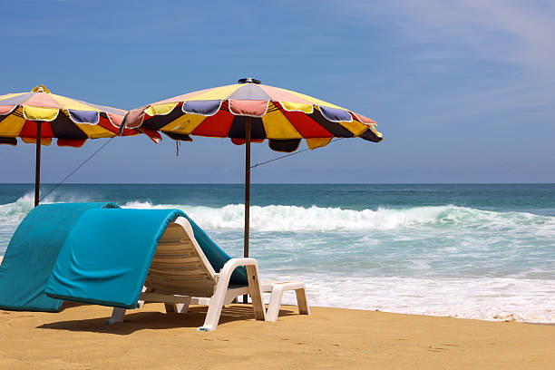 istock Deck chairs and parasols on a sandy beach 2224059878