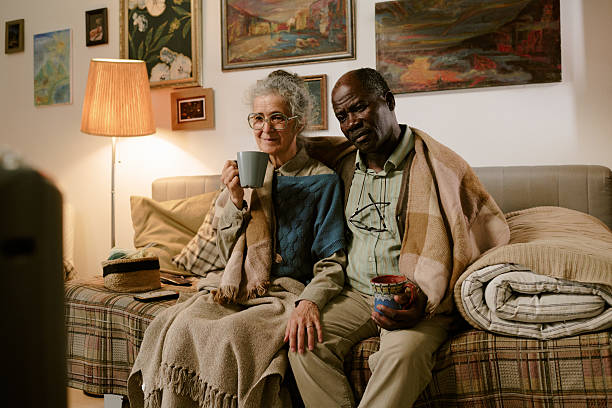 loving old african couple hugging outdoors, endless love, senior citizens lifestyle