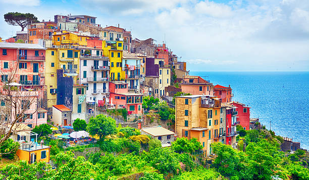 Corniglia is one of the five towns that make up the Cinque Terre region in Italy. Composite photo