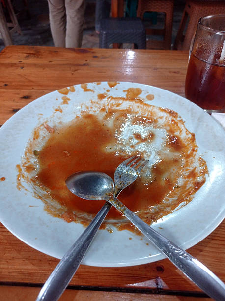 istock An empty plate with leftover spicy sauce from Mie Aceh. 2224062656