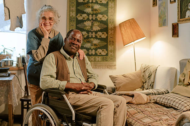 istock Multiethnic Elderly Couple Smiling Together in Modest Home 2224063664