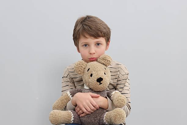 Portrait of a homeless child holding a dirty cloth in afghanistan