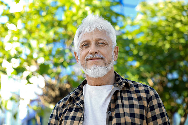 istock Portrait of senior man outdoors, low angle view 2224069072