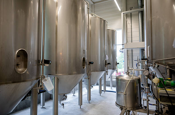 istock Stainless steel brewing tank inside modern craft brewery facility 2224070050