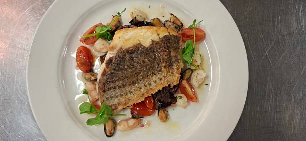 Elegant Seafood Platter Featuring Pan-Seared Fish with Fresh Vegetables