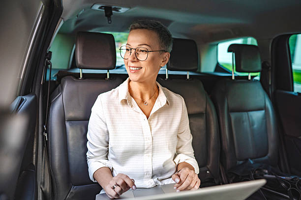 istock Professional Woman Working on Laptop in Car 2224075325