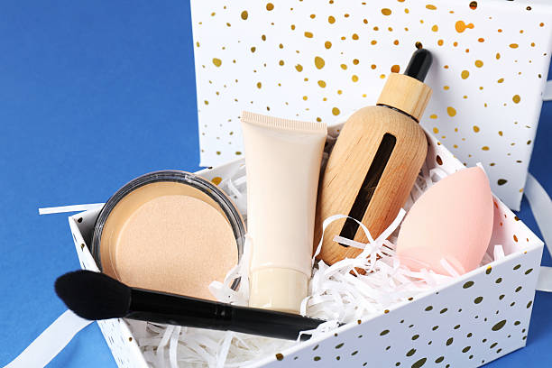 istock Cosmetic products in gift box on blue background, closeup 2224075597