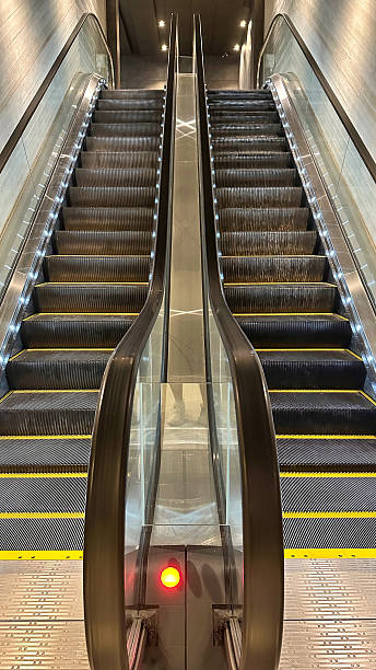 istock Two Empty Indoor Escalators with Luxury Lighting in Modern Building 2224075660