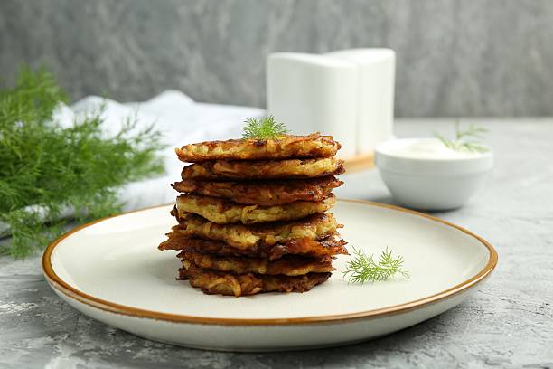 istock Delicious potato pancakes with fresh dill on grey textured table, closeup 2224076645